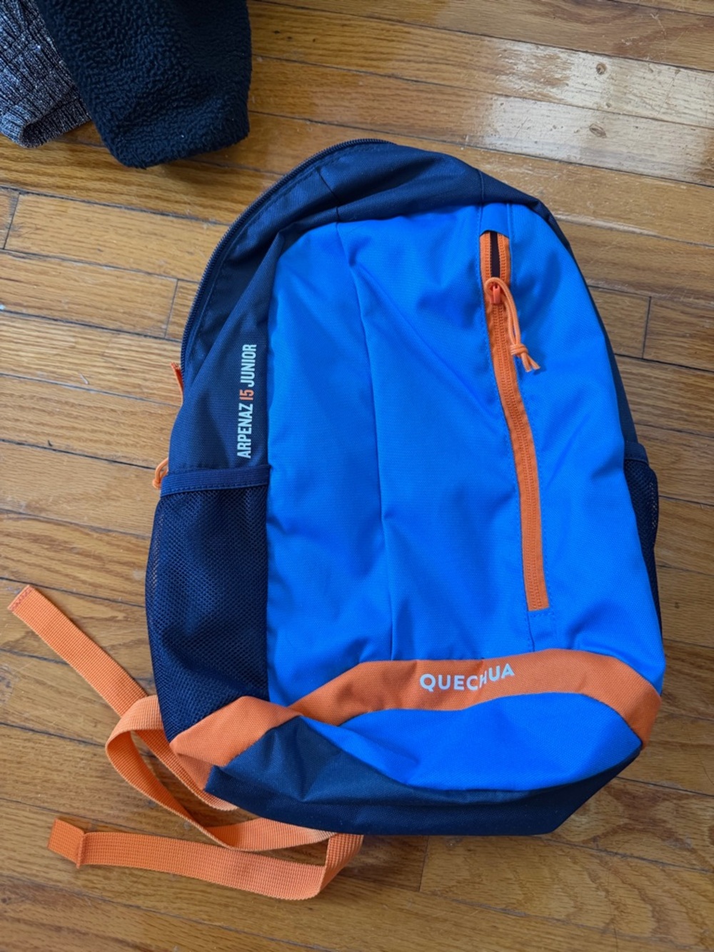 Quechua Blue and Orange Backpack with Black Accents